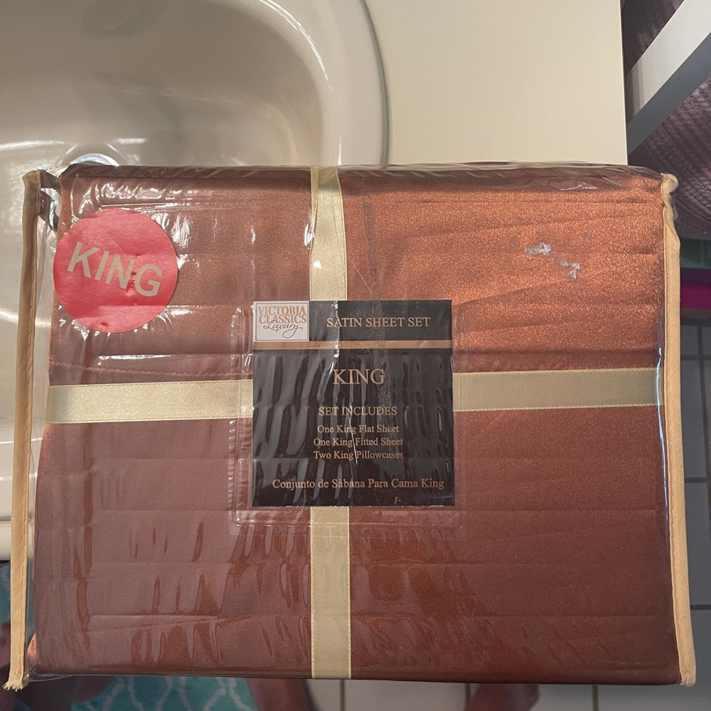 King size satin sheet set. New in packaging